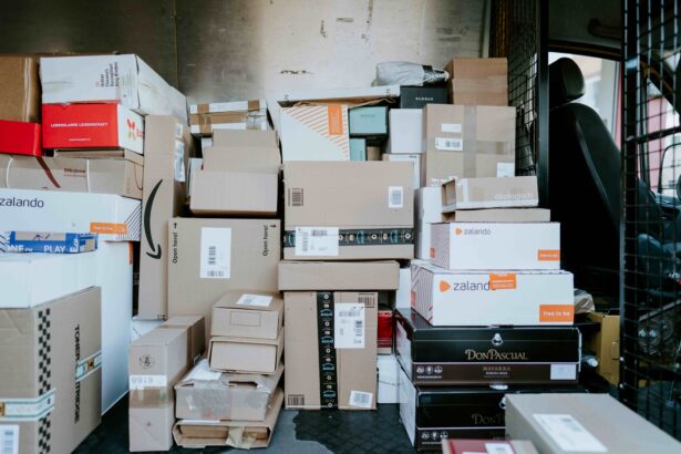 The cargo area of a delivery van is filled with stacked cardboard parcels and retail shipping boxes of various sizes, ready for transport and last-mile delivery.