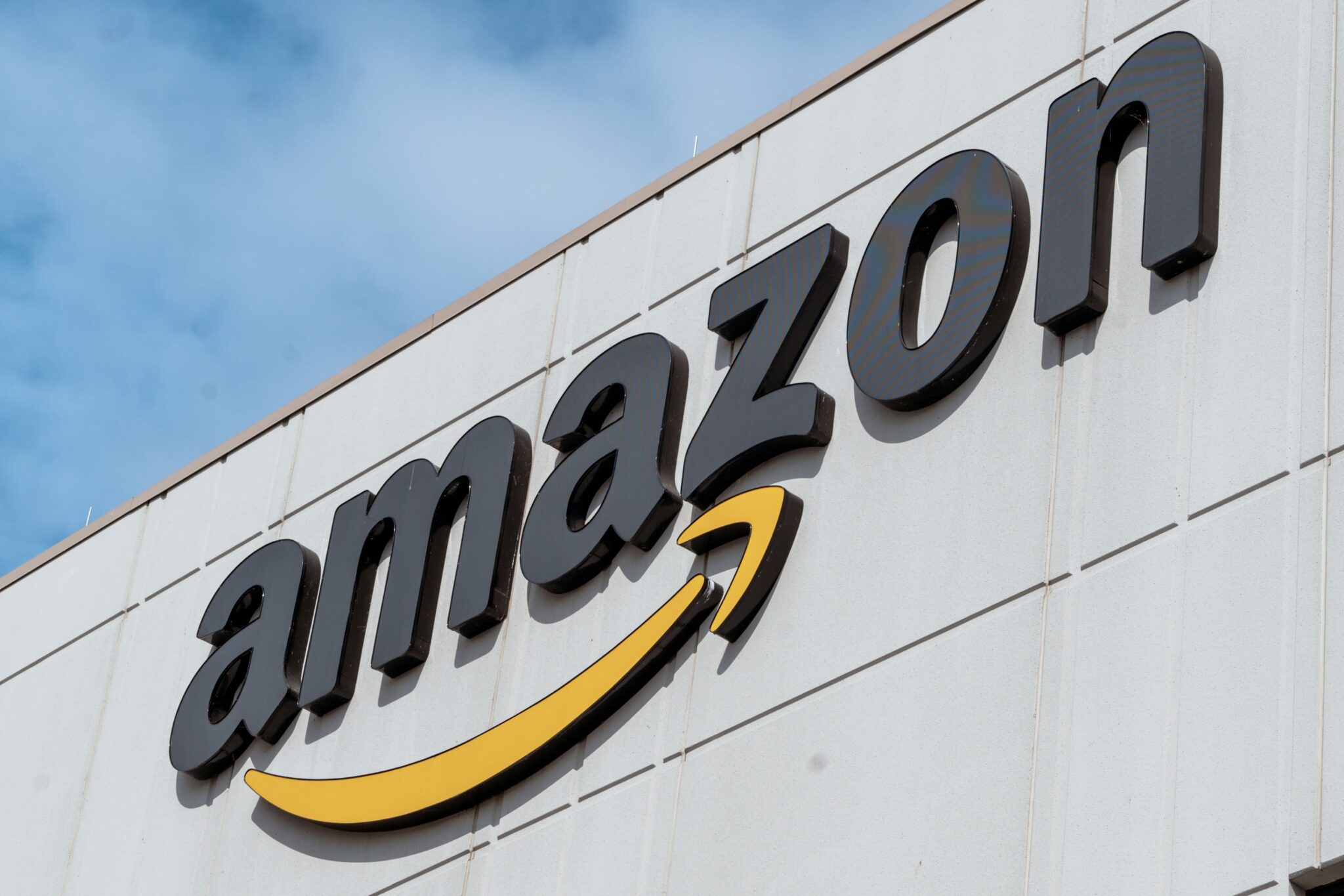 Amazon logo on the ground of a big building.