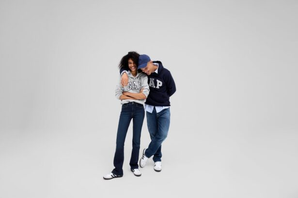 Two models wearing Gap hoodies and jeans pose together against a light grey background.