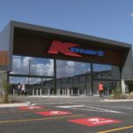 Exterior of a Kmart store with the Kmart logo above the main entrance.